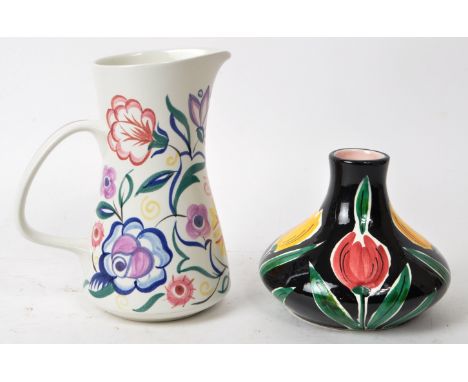 A pair of late 20th-century floral pottery pieces, comprised of a Poole Pottery 'CS K' pink, purple, green, and white floral 