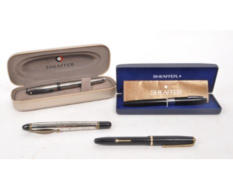 Sheaffer - Two vintage 20th century Sheaffer fountain pens, alongside two other examples. Each Sheaffer example in original b