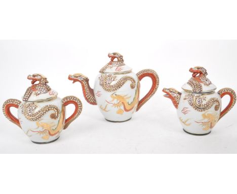 Three vintage 20th century Japanese dragon porcelain teapots. Having white ground with high reflie dragon figures to spout an