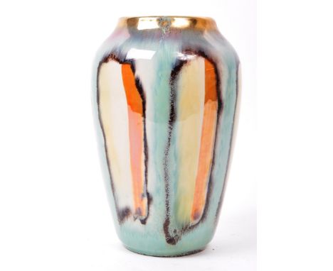 West German - A mid 20th century West German pottery ceramic vase. The vase having polychrome vase, with shades of orange, bl