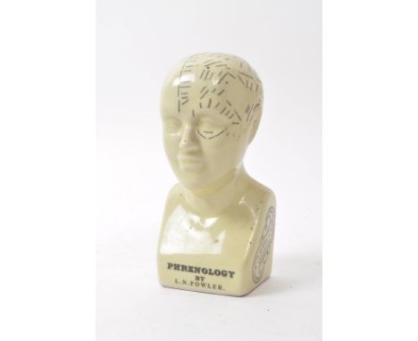 L. N. Fowler - A small mid century ceramic Phrenology bust. Having a sectional cranium in white colourway entered at the Stat