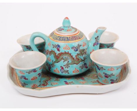 An early 20th century Chinese miniature / dolls house porcelain tea / coffee set. Compirising of teapot, four cups and tray. 