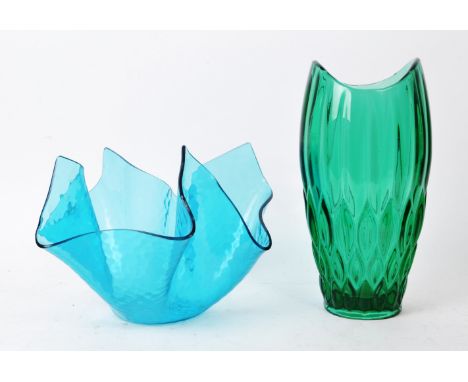 Two pieces of vintage mid-20th-century glass table pieces, comprised of a green vase, and a blue handkerchief vase. The green