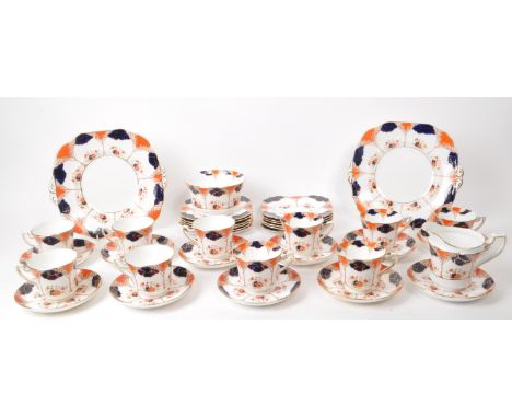 Wetley - Early 20th century English bone china tea service pieces, in an imari-style design. Comprising of ten tea cups, elev