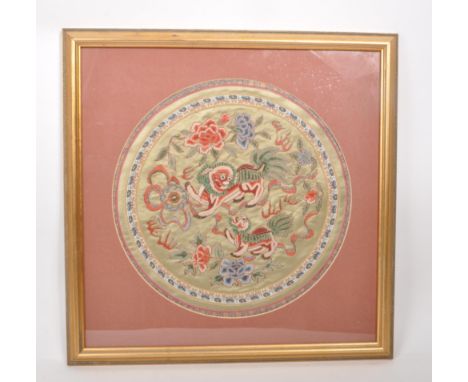 A vintage 20th century Chinese embroidered silk tapestry, featuring two Chinese dragons to the centre and floral decoration, 