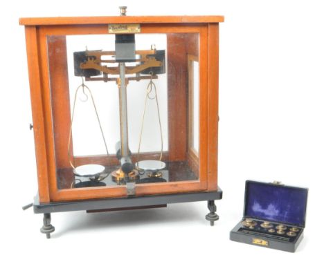 L. Oertling Ltd - An early 20th century London balance scales model. 52F.M and weights, stored in a mahogany glazed case with