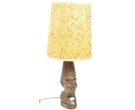 A West African believed Nigerian ebony wood carved bust sculpture lamp. Complete with shade atop.