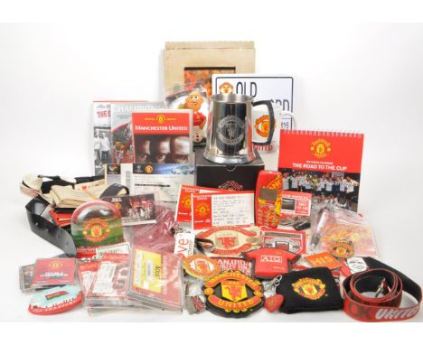 A collection of late 20th century / early 21st century Manchester United football memorabilia, comprised of a tankard, a Red 