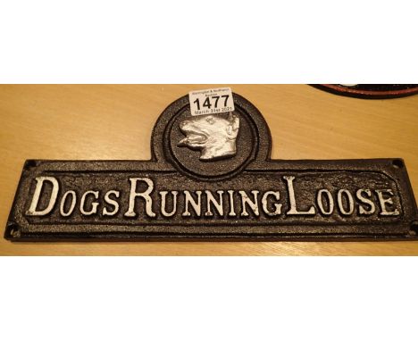 Cast iron Dogs Running Loose sign, L: 31 cm. P&amp;P Group 1 (£14+VAT for the first lot and £1+VAT for subsequent lots) 
