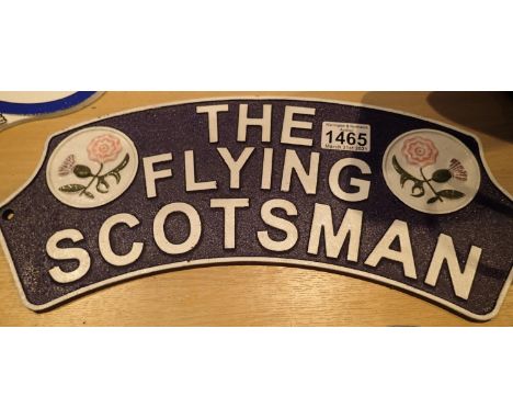 Cast iron blue the Flying Scotsman sign, L: 40 cm. P&amp;P Group 2 (£18+VAT for the first lot and £3+VAT for subsequent lots)