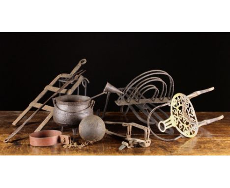 A Collection of Various Metal Implements: A late 18th century fire-bar toaster with revolving demi-lune rack, a wrought iron 