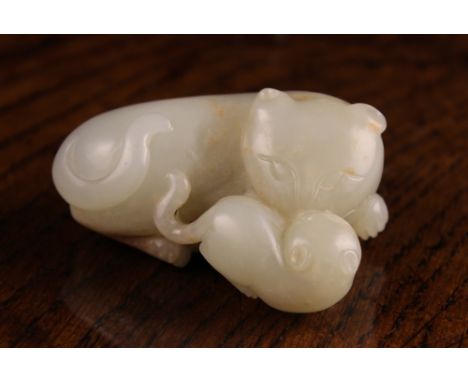 A 19th Century Jade Carving of a Cat and Kitten; celadon with russet inclusions, 2½ ins x 2 ins x 1 ins (6.5 cm x 5 cm x 2.6 