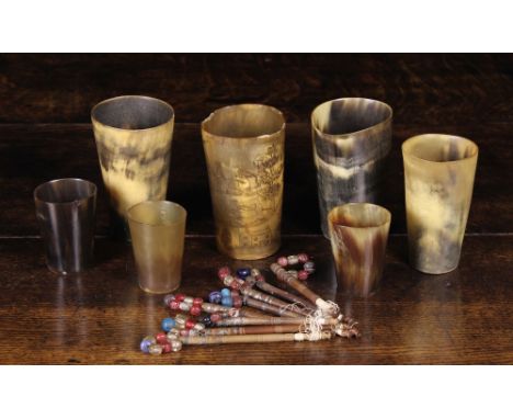 Seven Late 18th/Early 19th Century Horn Beakers; one engraved with a hunting scene spiralling around the sides, and a set of 