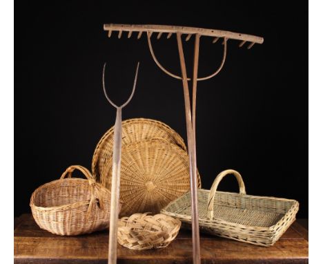 An Old Pitch Fork, A Hay Rake and Five Wicker Baskets: The pitch fork on an ash pole handle, 63 ins (160 cms) n length. The w