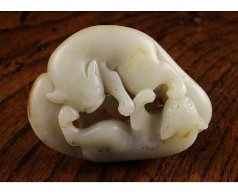 A 19th Century Chinese Jade Pebble Carving of two foxes playing, 2¾ ins x 21/8 ins x 1 ins (7 cm x 5.3 cm x 2.7 cms).
