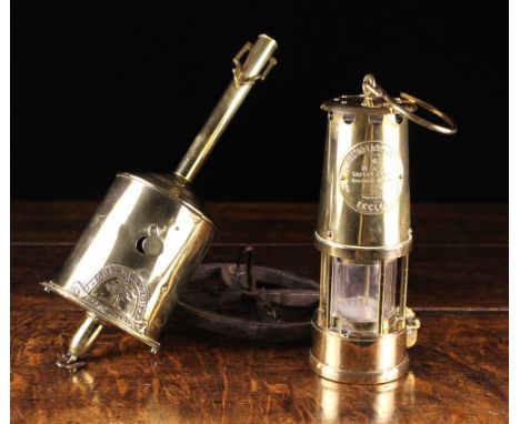 A 19th Century Clockwork Bottle Jack with maker's label embossed; 'John Linwood Warranted', and a brass miner's lamp with emb