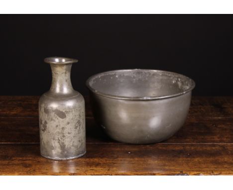 A 17th or 18th Century Pewter Bottle flask and Wash Bowl. The flask 10 ins (25.5 cms) high. The bowl 6 ins (15 cms) high, 12¼