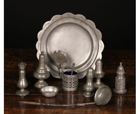 An 18th Century Pewter Plate with scalloped edge, and a collection of 18th and 19th century pepper pots, a mustard pot, a sal