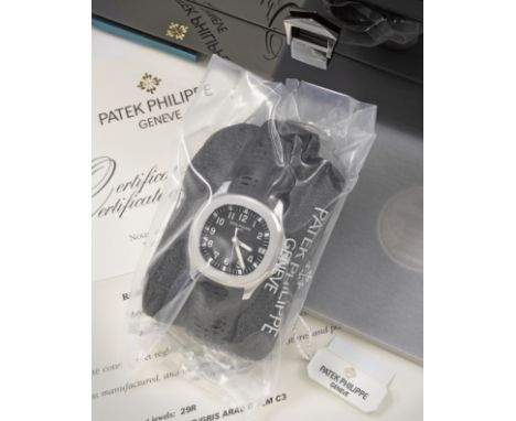 Patek Philippe. A fine service sealed stainless steel automatic calendar wristwatchModel: AquanautReference: 5165ADate: Purch