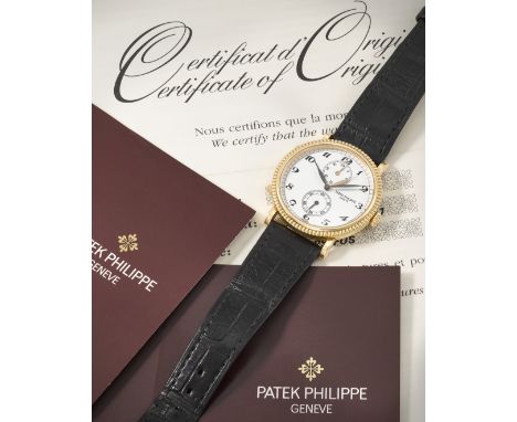 Patek Philippe. An 18K rose gold manual wind wristwatch with dual time zoneReference: 5034R-001Date: Purchased 15th January 1