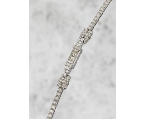 Cartier. A lady's rare platinum and diamond set manual wind bracelet watch offered on behalf of the family of the original ow