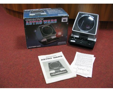 A Grandstand Leisure Products Astro Wars Electronic Game, (circa 1981), instruction leaflet and product warranty card present