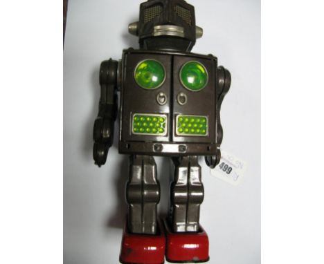 A Mid 1960's Tinplate Battery Operated Attacking Martian Robot, by Harikand Masudaya. Some signs of corrosion to battery area