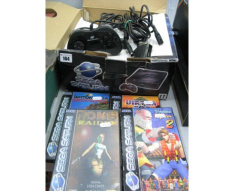 A Boxed Sega Saturn Gaming Console, including game controller, games: Daytona USA, Tomb Raider, Virton Cop, Virtua Fighter 2,