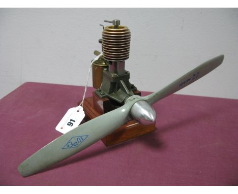 An Early Engineered Model Aeroplane Diesel Engine, finished in brass/bright metal; fitted with 12" nylon prop and mounted on 
