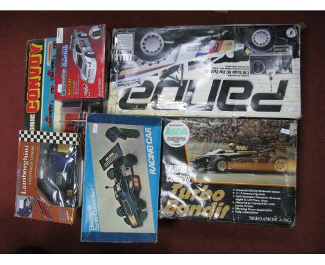 Six Plastic Model Radio/Sonic Control Vehicles, by Corgi, Nikko America, Thunder Tiger, Saicon and other, including 1:10th sc