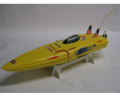 A Kit Built 1:25th Scale R/C Model Racing Boat, by Robbe, the Magin one is based on a Mono II racing boat class. Battery powe