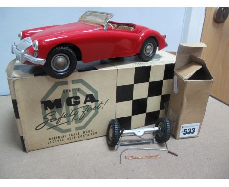 A Model of an MGA by Victory Models, battery operated, finished in red, small parts appear intact, however windscreen broken,