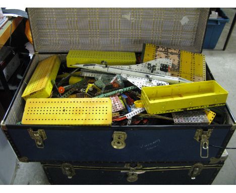 A Very Large Quantity of Mid XX Century and Later Meccano, all playworn and contained in a large travel trunk, worthy of full