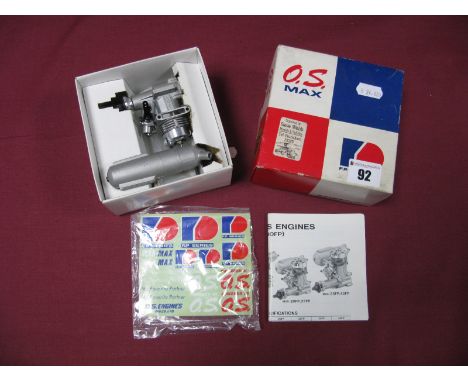 A "O.S Max" 2.49cc Ref 15FP Glow Plug Engine,  unused in original box with instructions.
