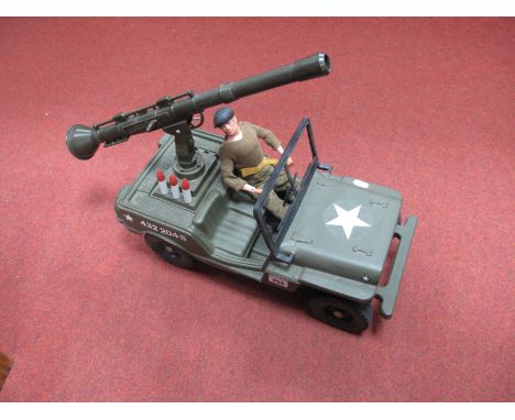 An Original Action Man, fixed eyes, flock hair, gripping hands in Cherilea 'Bazooka' Jeep.