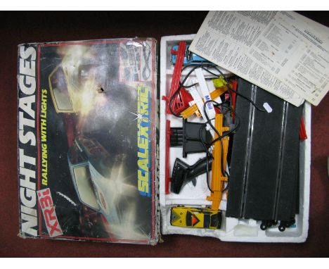 A Scalextric Nightstages XR3i Set, including two Ford Escort XR3i slot cars, two controllers, track, barriers, unchecked, pla