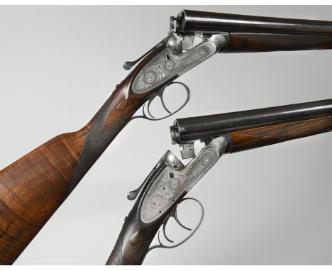 Nos. 17837 and 17838, circa 1912, with 28” barrels, the frames and fences with classic bouquet and scroll engraving and with 