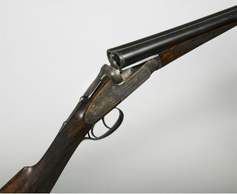 the 27 1/2" barrels with sunken top rib, the frames with best bouquet and scroll engraving, well figured 13 7/8" walnut stock