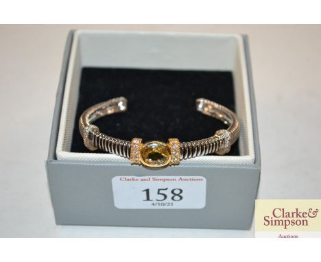 A white metal and topaz style bangle