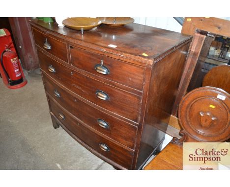 A mahogany bow fronted chest of two short and three long drawers raised on bracket feet, brackets later handles