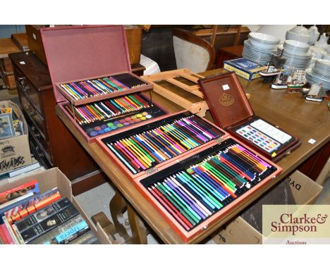 A quantity of various artists pencils; paints and a travelling easel