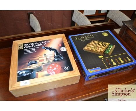 A wooden games compendium and a Schach magnetic chess set