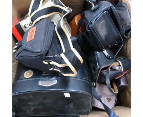 A mixed quantity of vintage cameras to include a Canon T-70, Canon MC compact in outfit case, Canon Dial half-frame, Kodak In