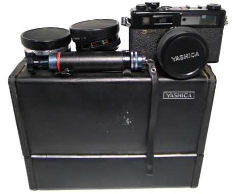 A Yashica Electro 35GT range finder camera outfit complete with supplementary telephoto and wide angle lenses, filters, cable