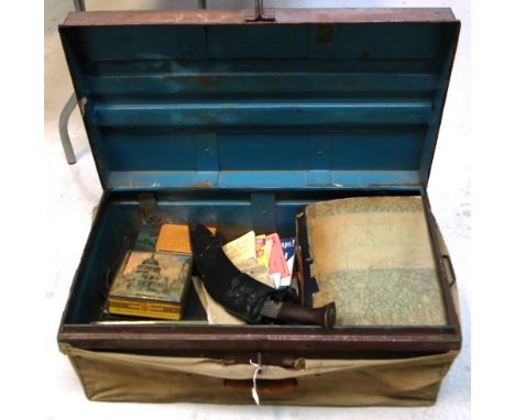 A large metal canvas covered travel trunk containing a collection of militaria items used and collected by James Anthony Rank