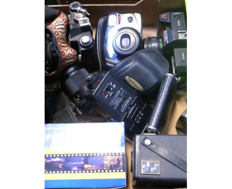 A Zenith 12XP 35mm SLR camera, a Carl Zeiss Jena f3.5 135mm telephoto lens, a Samsung auto focusing zoom compact camera, a bo