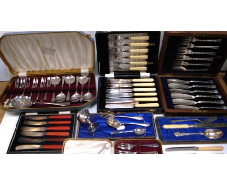 A cased hallmarked silver spoon and fork set, marks rubbed and seven other cased plated sets of knives, forks, spoons etc.