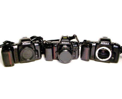 A Nikon F-801 with manual focus Soligor 28mm wide angle lens and two Nikon F-601 bodies (3).
