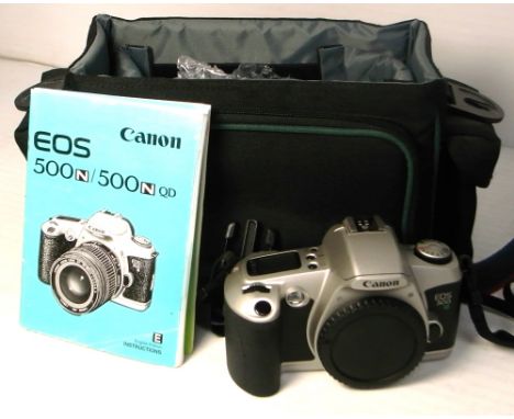 A Canon EOS 500 N camera, body only, in a Cobra holder, with manual.