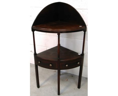 A late 19th early 20th century mahogany corner unit/whatnot with two lower drawers and shelf above on legs.